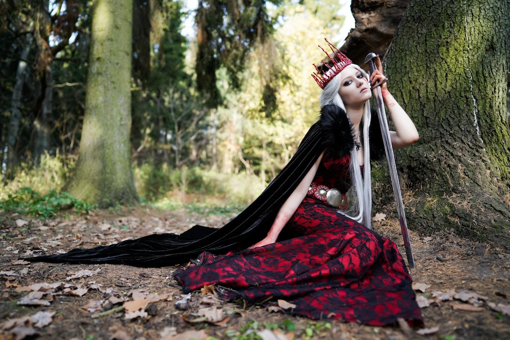 Medieval queen posing with sword